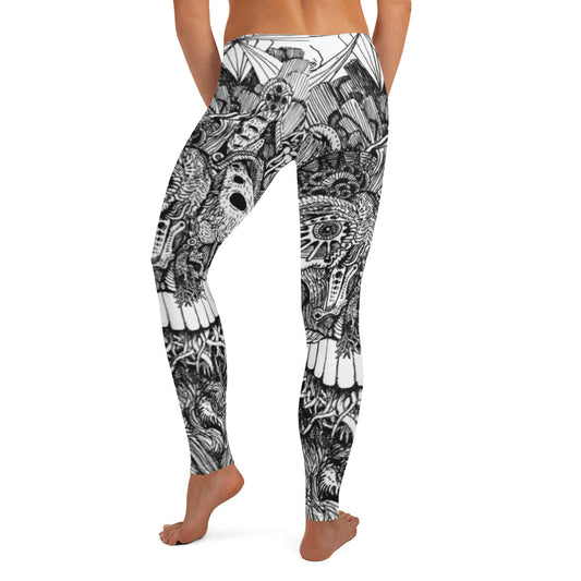 White Leggings with black linework on them of an alien creature. The linework is extensive and contains a lot of detail