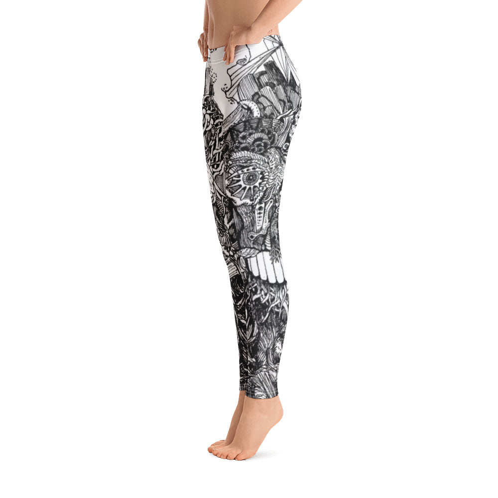 White Leggings with black linework on them of an alien creature. The linework is extensive and contains a lot of detail