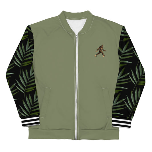 Muted green bomber jacket with black arms with palm leaf design on them. A cartoon Sasquatch is on the right lapel, left side for the wearer. White stripes horizontal across cuffs