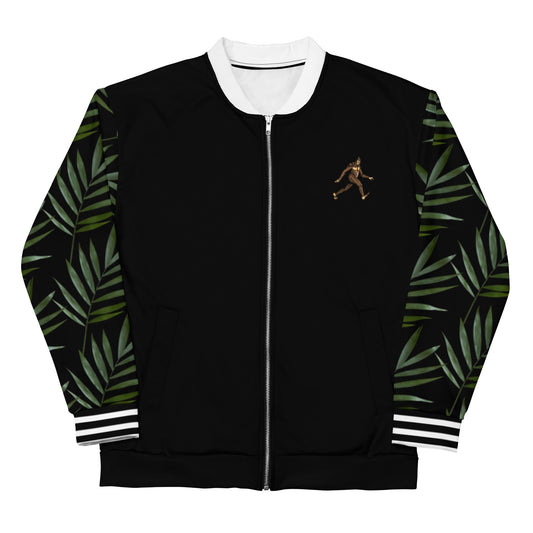 Black bomber jacket with black arms with palm leaf design on them. A cartoon Sasquatch is on the right lapel, left side for the wearer. White stripes horizontal across cuffs