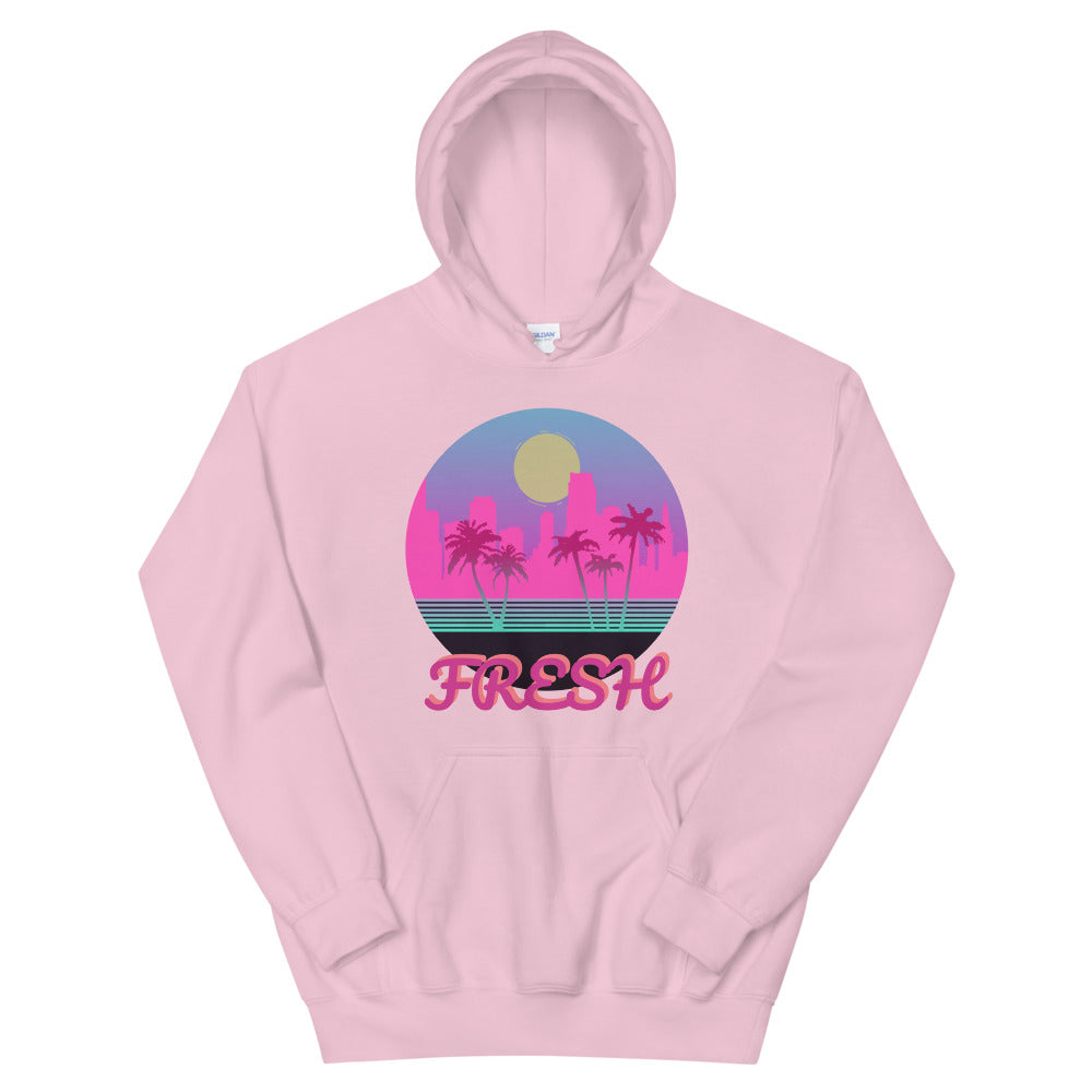 A light pink hoodie with a logo on the front centre. It is a round logo of the Miami skyline. Palm trees frame the image. Fresh is sprawled across the front bottom of the logo